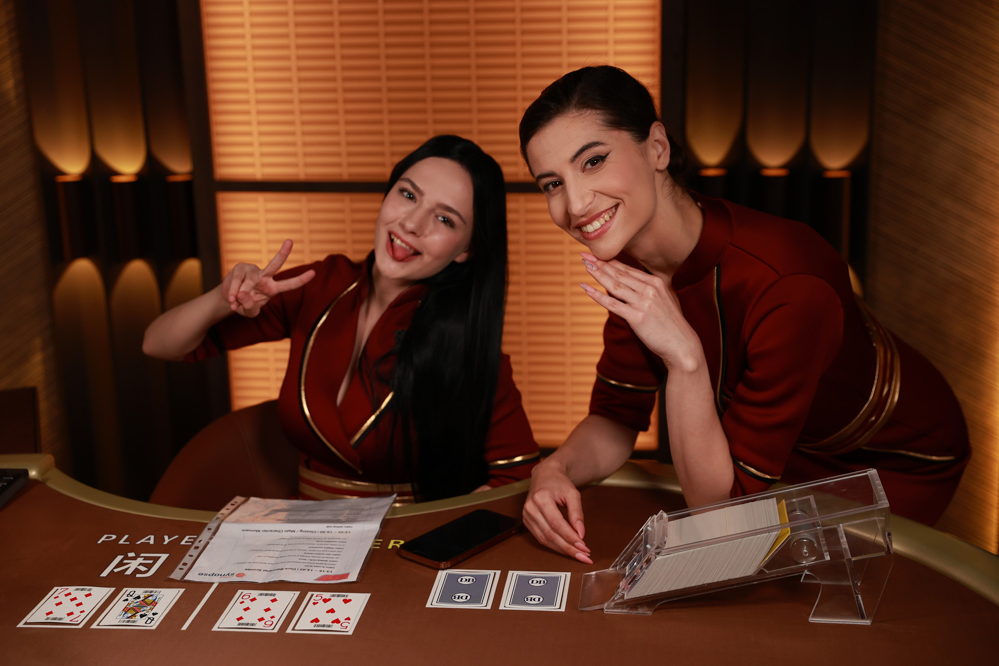 FOYU LIVE team smiling at a casino table